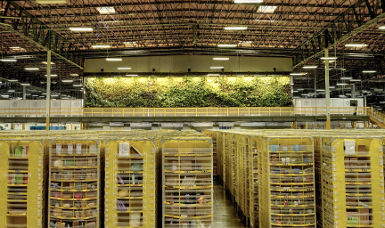 Towers of inventory are shown in a fulfillment center.